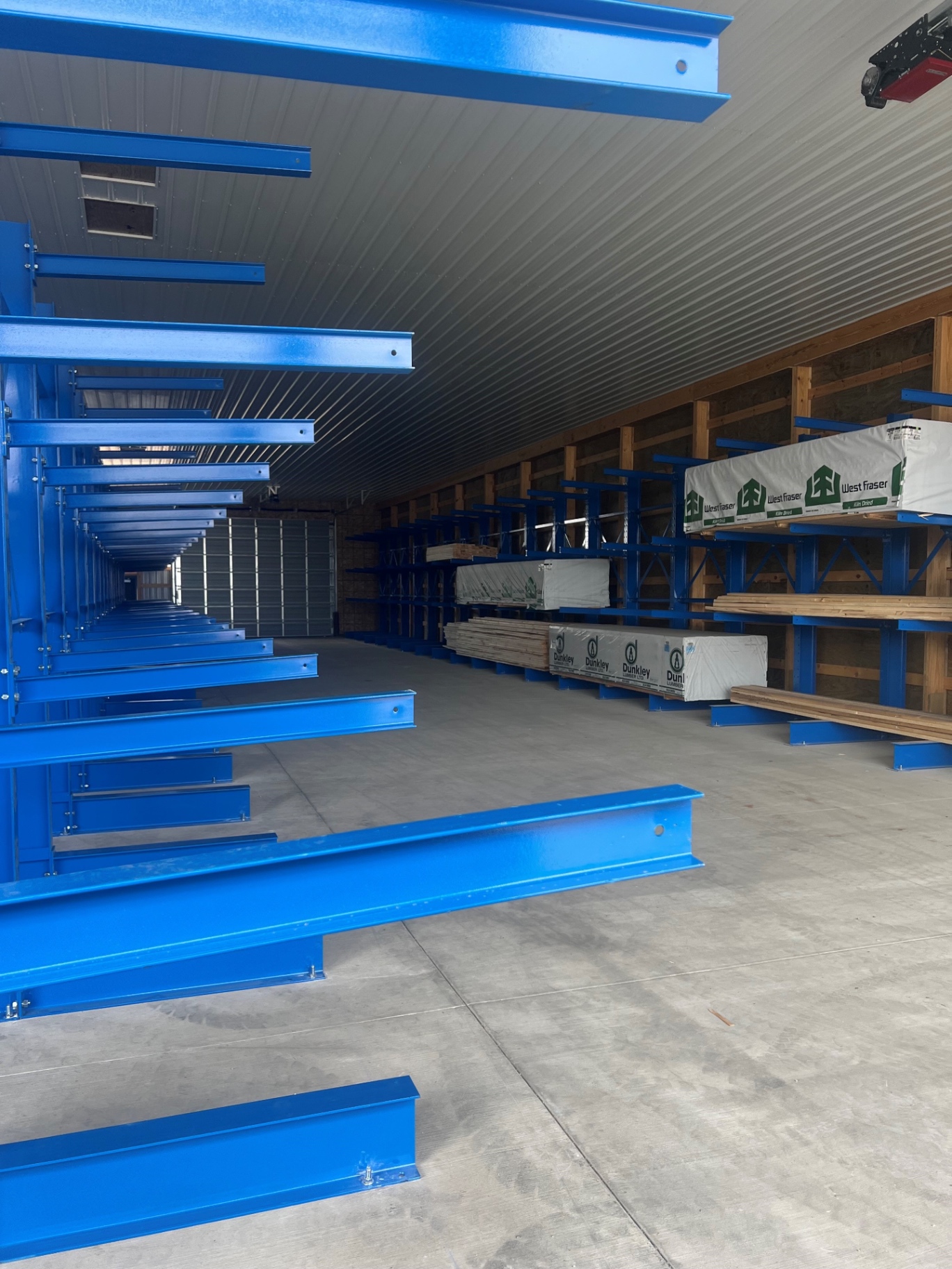 Cantilever racking stocked with lumber inside the NAWL warehouse